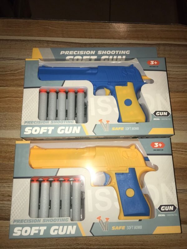 Pistola con balas de goma